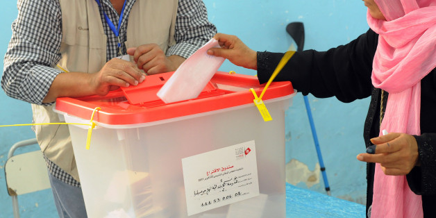 (GERMANY OUT) October 23, 2011- Tunis, Tunisia: A Tunisian woman is casting her vote for the 217-seat assembly at a school in a poor part of town . Polls open in Tunisia in the first free election of the Arab spring, nine month after the fall of former President Zinedine el Abidine Ben Ali in Tunis. (Photo by Alpeyrie/ullstein bild via Getty Images)