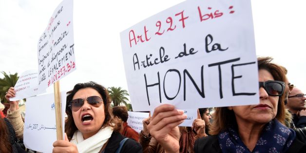 Tunisian women hold placards during a demonstration against the article 227 bis of the penal code on December 14, 2016, outside the Assembly of the Representatives of the People in Tunis, after a Tunisian court has approved the marriage of a 13-year-old girl to a relative who made her pregnant.
Under Tunisian law, sex with a girl under 15 without the use of force is punishable by six years in prison, but the culprit can halt proceedings by marrying the victim.
/ AFP / FETHI BELAID (Photo credit should read FETHI BELAID/AFP/Getty Images)