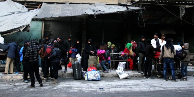 ALEPPO, SYRIA - DECEMBER 15: Civilians from the besieged area wait to be evacuated from eastern Aleppo under the siege of Iranian-led Shia militias and Assad regime forces in Aleppo, Syria on December 15, 2016. (Photo by Ahmad Hashesho/Anadolu Agency/Getty Images)