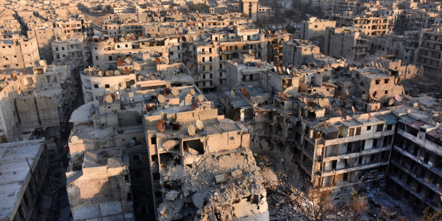 A general view of Aleppo taken from the top of a building in the city's Bustan al-Basha neighbourhood on November 28, 2016, during Syrian government forces assault to retake the entire northern city from rebel fighters.In a major breakthrough in the push to retake the whole city, regime forces captured six rebel-held districts of eastern Aleppo over the weekend, including Masaken Hanano, the biggest of those in eastern Aleppo. / AFP / GEORGE OURFALIAN (Photo credit should read GEORGE OU