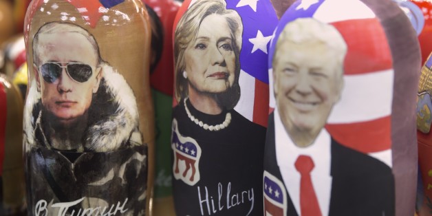 Traditional Russian wooden dolls called Matreska depicting from left, Russian president Vladimir Putin and US presidential candidates Hillary Clinton and Donald Trump are displayed in a shop in Moscow, Russia on Tuesday, Nov. 8, 2016. Tens of millions of voters across the United States will now decide on the next occupant of the White House as polling stations open across the country. (AP Photo/Pavel Golovkin)