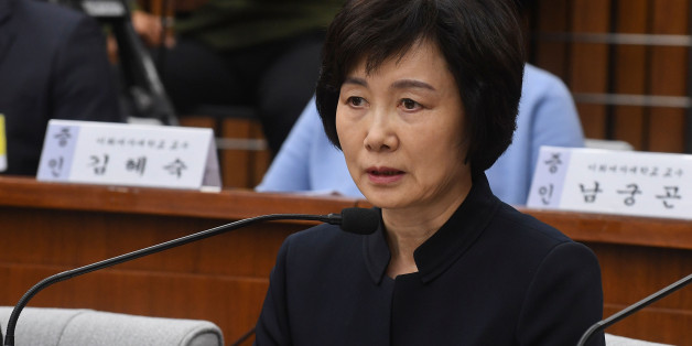 SEOUL, SOUTH KOREA - DECEMBER 15: Choi Kyung-Hee, former president of Ewha Womans University, answers questions during a parliamentary hearing over the Choi Soon-sil gate probe at the National Assembly on December 15, 2016 in Seoul, South Korea. South Korea started the fourth round of a parliament hearing on the corruption scandal involving impeached President Park Geun-Hye. (Photo by Kim Min-Hee-Pool/Getty Images)