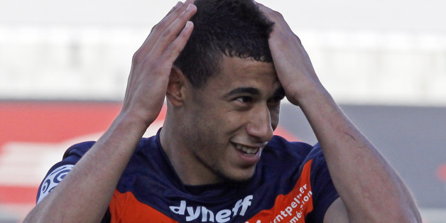 Montpellier's Younes Belhanda reacts after scoring against Olympique Marseille during their French Ligue 1 soccer match at the Velodrome stadium in Marseille, April 11, 2012. REUTERS/Jean-Paul Pelissier (FRANCE - Tags: SPORT SOCCER)