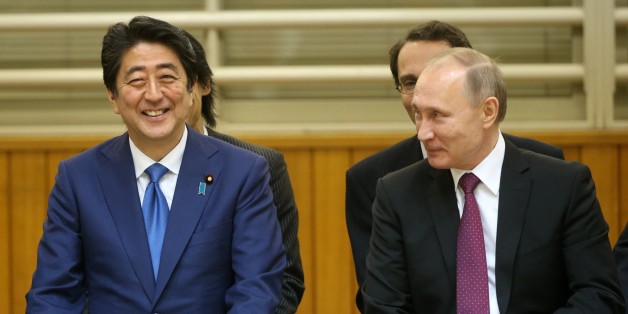 TOKYO, JAPAN - DECEMBER 15: (RUSSIA OUT) Russian President Vladimir Putin (R) and Japanese Prime Minister Shinzo Abe (L) are seen visiting the Kodokan Judo Institute on December 16, 2016 in Tokyo, Japan. Russian President is on a two-day visit to Japan. (Photo by Mikhail Svetlov/Getty Images)