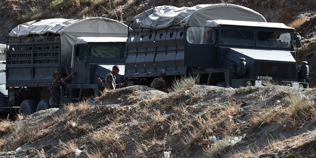 Algerian army troops carry out search operations in the mountainous eastern Tizi Ouzou region in a desperate bid to find French hiker Herve Gourdel who was kidnapped by militants linked to the Islamic State group who have threatened to execute him on September 23, 2014 near the village of Ait Ouaban, 80 km south of Tizi Ouzou. Paris vowed it would not negotiate with jihadists, as the local army raced against time to find him before his threatened execution. AFP PHOTO / FAROUK BATICHE (P