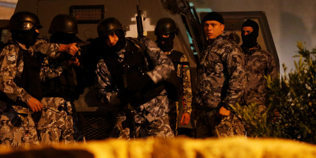 Jordanian policemen operate in the vicinity of Karak Castle, where armed gunmen carried out an attack, in the city of Karak, Jordan, December 18, 2016.REUTERS/Muhammad Hamed