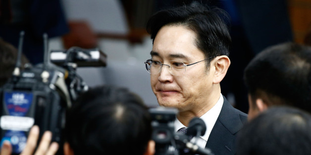SEOUL, SOUTH KOREA - DECEMBER 06: Lee Jae-Yong, vice chairman of Samsung leaves to adjourn for lunch during a parliamentary hearing over the Choi Soon-sil gate probe at the National Assembly on December 6, 2016 in Seoul, South Korea. South Korea started the parliament hearing with leaders of nine South Korean conglomerates including Samsung, Hyundai and Lotte over the tens of millions of dollars given to foundations controlled by Ms Park's friend Choi Soon-sil, the woman at the center of the sc