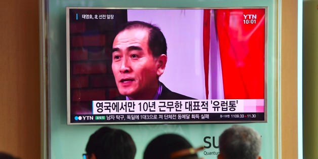People watch a television news broadcast showing file footage of Thae Yong-Ho, North Korea's deputy ambassador to Britain, at a railway station in Seoul on August 18, 2016.South Korea said on August 17 that North Korea's deputy ambassador to Britain had defected to Seoul, in a rare and damaging loss of diplomatic face for Pyongyang. / AFP / JUNG YEON-JE (Photo credit should read JUNG YEON-JE/AFP/Getty Images)