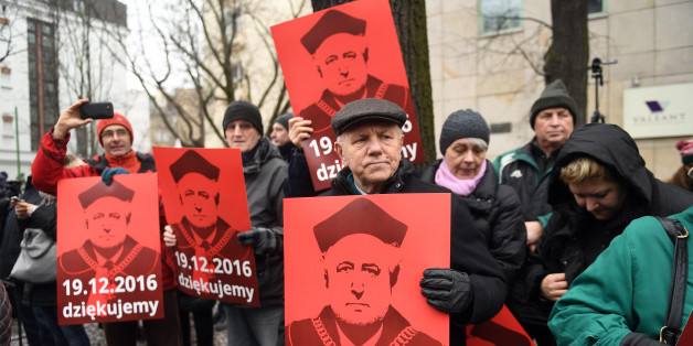 WARSAW, POLAND DECEMBER 18: (SOUTH AFRICA AND POLAND OUT) People holding banners participate in the Komitet Obrony Narodowej (KOD) demonstration on December 18, 2016 in front of the Constitutional Tribunal in Warsaw, Poland. The demonstration refers to the Polish Constitutional Court crisis which began in 2015. (Photo by Maciej Gillert/Gallo Images Poland/Getty Images)