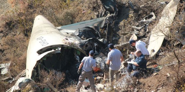 Overseas investigators examine the wreckage of a Pakistan International Airlines (PIA) passenger plane which crashed near the village of Saddha Batolni in the Abbottabad district of Khyber Pakhtunkhwa province on December 13, 2016.
The chairman of Pakistan's embattled national carrier has resigned following a fatal plane crash December 7 that killed 47 people, one of the country's deadliest air disasters. / AFP / SHAKEEL AHMED (Photo credit should read SHAKEEL AHMED/AFP/Getty Images)