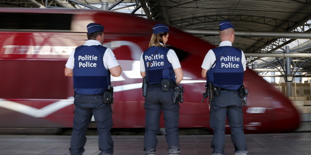Belgian police officers stand guard on a platform at the Thalys high-speed train terminal at Brussels Midi/Zuid railway station, August 22, 2015. A machine gun-toting attacker wounded three people on a high-speed train in France on Friday before being overpowered by passengers who included an American soldier. REUTERS/Francois Lenoir