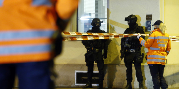 Police stand outside an Islamic center in central Zurich, Switzerland December 19, 2016. REUTERS/Arnd Wiegmann