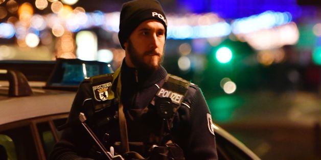A policeman stands near the site where a truck speeded into a christmas market in Berlin, on December 19, 2016 killing nine persons and injuring at least 50 people. / AFP / John MACDOUGALL (Photo credit should read JOHN MACDOUGALL/AFP/Getty Images)