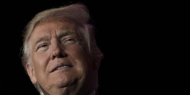 US President-elect Donald Trump looks on while speaking during a 'Thank You Tour 2016' rally in Orlando, Florida on December 16, 2016. / AFP / JIM WATSON (Photo credit should read JIM WATSON/AFP/Getty Images)