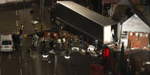 Authorites continue to remove bodies hours after a truck sped into a Christmas market in Berlin, on December 19, 2016, killing at least nine people and injuring dozens more.Ambulances and heavily armed officers rushed to the area after the driver drove up the pavement of the market in a square popular with tourists, in scenes reminiscent of the deadly truck attack in the French city of Nice last July. / AFP / Odd ANDERSEN (Photo credit should read ODD ANDERSEN/AFP/Getty Images)