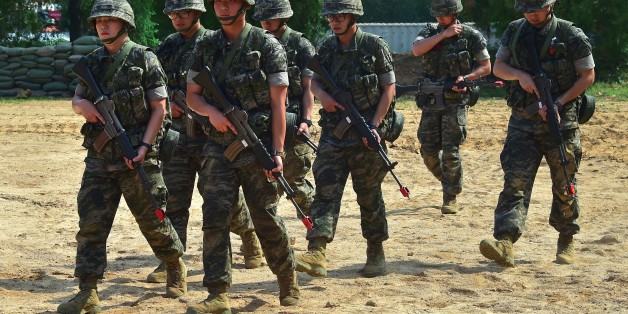South Korean marines move after a demonstration during a press tour to General Outpost (GOP) of 2nd Marine Division at a military base in Gimpo near the Demilitarized Zone dividing the two Koreas on June 10, 2016.The Korean peninsula is the world's last Cold War frontier as Stalinst North Korea and pro-Western South Korea have been technically at war since the 1950-53 Korean War. / AFP / JUNG YEON-JE (Photo credit should read JUNG YEON-JE/AFP/Getty Images)