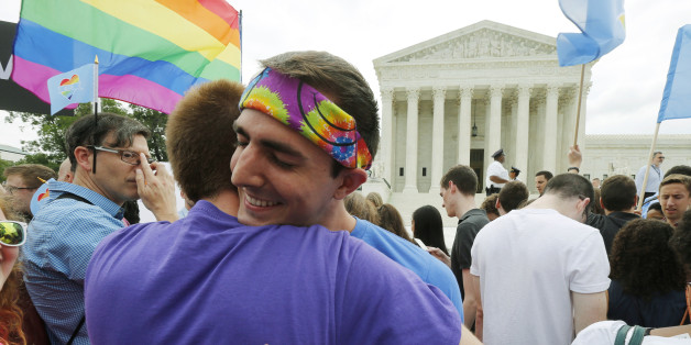 Gay rights supporters celebrate after the U.S. Supreme Court ruled that the U.S. Constitution provides same-sex couples the right to marry, outside the Supreme Court building in Washington, June 26, 2015. The court ruled 5-4 that the Constitution's guarantees of due process and equal protection under the law mean that states cannot ban same-sex marriages. REUTERS/Jim Bourg