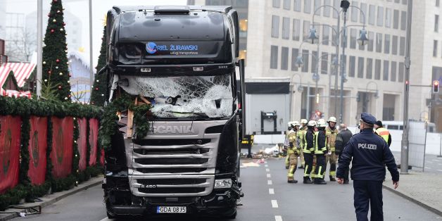 A policeman walks past a truck that crashed into a Christmas market on December 20, 2016 in Berlin.German police said they were treating as 'a probable terrorist attack' the killing of 12 people when the speeding lorry cut a bloody swath through the packed Berlin Christmas market. / AFP / Tobias SCHWARZ (Photo credit should read TOBIAS SCHWARZ/AFP/Getty Images)
