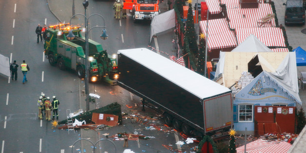 Rescue workers tow the truck which ploughed into a crowded Christmas market in the German capital last night in Berlin, Germany, December 20, 2016.. REUTERS/Fabrizio Bensch