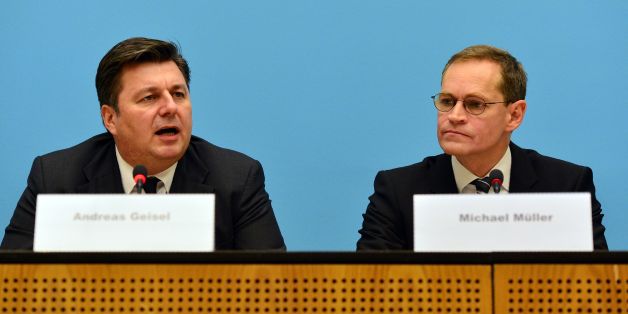 Berlin's mayor Michael Müller (R) and Interior Senator Andreas Geisel (L) give a press conference on December 20, 2016 the day after a terror attack in central Berlin.German police said they were treating as 'a probable terrorist attack' the killing of 12 people when the speeding lorry cut a bloody swath through the packed Berlin Christmas market. / AFP / dpa / Maurizio Gambarini / Germany OUT (Photo credit should read MAURIZIO GAMBARINI/AFP/Getty Images)