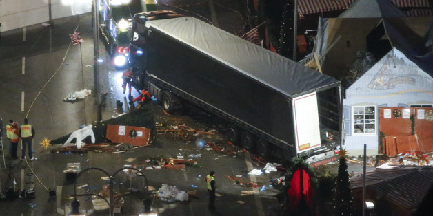 A used suit of a forensic investigator lies on a Christmas tree where a truck ploughed through a crowded Christmas market killing 12 people in the west of Berlin, Germany, December 20, 2016 REUTERS/Fabrizio Bensch