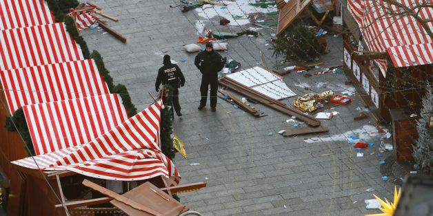Police patrol inside the Christmas market area two days after an attack with a truck in front of the Kaiser-Wilhelm-Gedaechtniskirche (Kaiser Wilhelm Memorial Church) in Berlin on December 21, 2016.
German police on December 21, 2016 stepped up their hunt for the driver of a truck that ploughed through a Berlin Christmas market, in a deadly assault claimed by the Islamic State jihadist group. / AFP / Odd ANDERSEN (Photo credit should read ODD ANDERSEN/AFP/Getty Images)