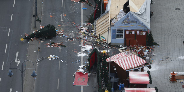 A christmas tree lays on the street beside the empty Christmas market in Berlin, Germany, December 20, 2016, after a truck ploughed through a crowd at the Christmas market on Monday night. REUTERS/Hannibal Hanschke
