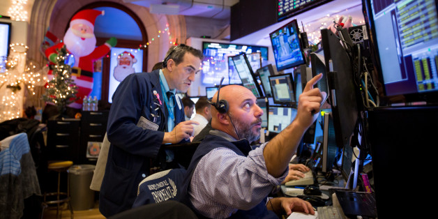 Traders work on the floor of the New York Stock Exchange (NYSE) in New York, U.S., on Monday, Dec. 12, 2016. U.S. stocks were little changed as a sharp rally in oil prices boosted shares in energy companies, offsetting losses in industrial and consumer discretionary shares. Photographer: Michael Nagle/Bloomberg via Getty Images