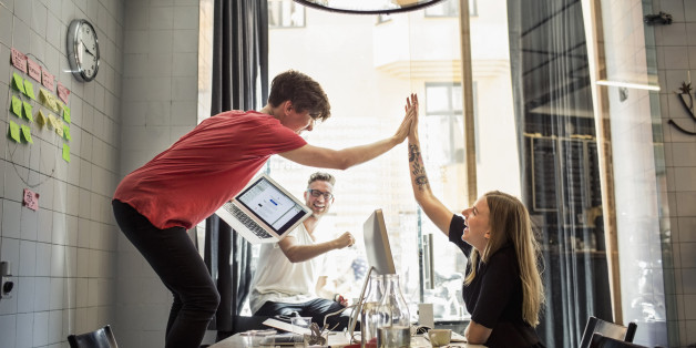 Successful team of new business people in creative office