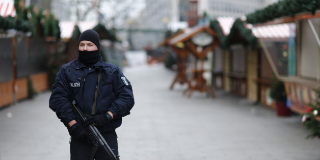 Police stands guard at the Kaiser-Wilhelm-Gedaechtniskirche Christmas market in Berlin, Germany, December 21, 2016, after a truck ploughed through a crowd at the Breitscheid square Christmas market on Monday night. REUTERS/Hannibal Hanschke