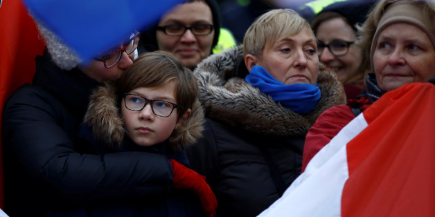 Demonstrators holding Polish and EU flags gather outside the Parliament building during a protest in Warsaw, Poland, December 17, 2016. REUTERS/Kacper Pempel