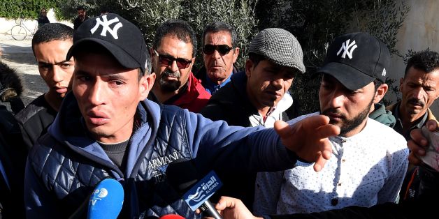 Walid (L) and Abdelkader(2nd R) Amri, the brothers of 24-year-old Anis Amri, the prime suspect in Berlin's deadly truck attack, talk to the media in front of their family house in the town of Oueslatia, in Tunisia's region of Kairouan on December 22, 2016.
German authorities came under fire after it emerged that the prime suspect in Berlin's deadly truck attack, a rejected Tunisian asylum seeker, was known as a potentially dangerous jihadist.
/ AFP / FETHI BELAID (Photo credit should read FETHI BELAID/AFP/Getty Images)