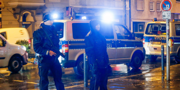 Policemen stand in front of a house in Dortmund, western Germany, on December 22, 2016.
According to media reports, German police detained four people in the western city of Dortmund, probably in connection with the manhunt for 24-year-old Tunisian Anis Amri suspected of having committed the Berlin Christmas market terror attack on December 19, 2016. / AFP / DPA / Stephan SCHUETZE / Germany OUT (Photo credit should read STEPHAN SCHUETZE/AFP/Getty Images)