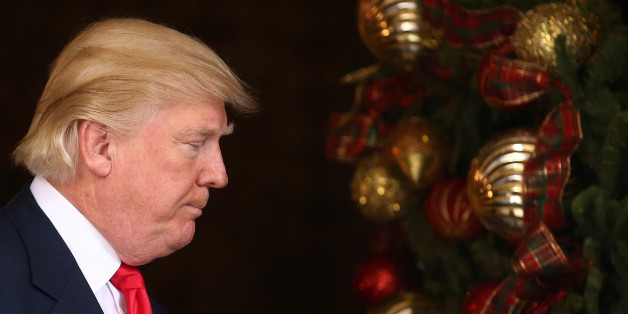 U.S. President-elect Donald Trump leaves after talking to members of the media at Mar-a-Lago estate where Trump attends meetings, in Palm Beach, Florida, U.S., December 21, 2016. REUTERS/Carlos Barria