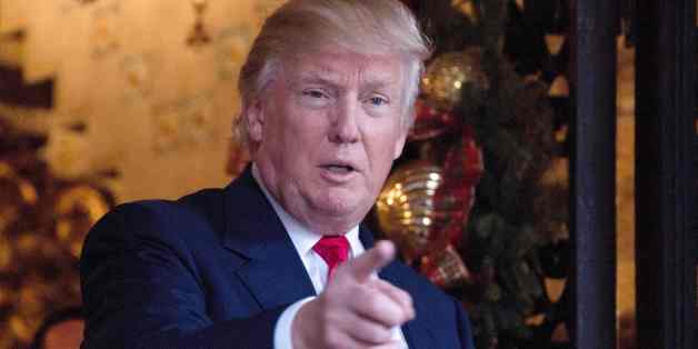 US President-elect Donald Trump speaks to reporters at Mar-a-Lago in Palm Beach, Florida where he is taking meetings on December 21, 2016. / AFP / JIM WATSON (Photo credit should read JIM WATSON/AFP/Getty Images)