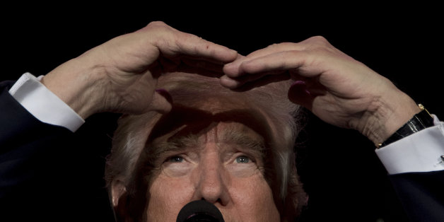 US President-elect Donald Trump looks on while speaking during a 'Thank You Tour 2016' rally in Orlando, Florida on December 16, 2016. / AFP / JIM WATSON (Photo credit should read JIM WATSON/AFP/Getty Images)