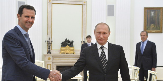Russian President Vladimir Putin (R) shakes hands with Syrian President Bashar al-Assad during a meeting at the Kremlin in Moscow, Russia, October 20, 2015. Assad made a surprise visit to Moscow on Tuesday evening to thank Putin for launching air strikes against Islamist militants in Syria. Picture taken October 20, 2015. REUTERS/Alexei Druzhinin/RIA Novosti/Kremlin ATTENTION EDITORS - THIS IMAGE HAS BEEN SUPPLIED BY A THIRD PARTY. IT IS DISTRIBUTED, EXACTLY AS RECEIVED BY REUTERS, AS A SERVICE