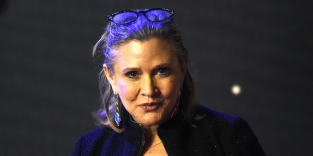 Carrie Fisher poses for cameras as she arrives at the European Premiere of Star Wars, The Force Awakens in Leicester Square, London, December 16, 2015. REUTERS/Paul Hackett