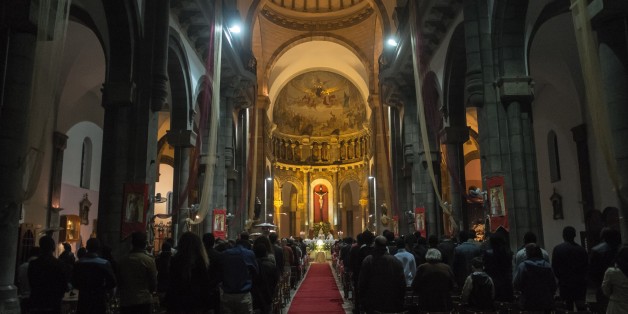 TUNIS, TUNISIA - DECEMBER 24: People attend a mass, led by Ilario Antoniazzi, Archbishop of Roman Catholic Archdiocese of Tunis during Christmas Eve, marking the birth of Jesus Christ, at St. Vincent de Paul Cathedral in Tunis, Tunisia on December 24, 2015. (Photo by Amine Landoulsi/Anadolu Agency/Getty Images)