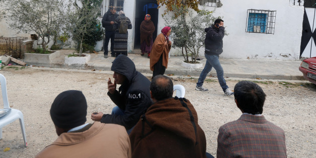 Neighbours leave the home of the parents of the Berlin Christmas market truck attack suspect Anis Amri, in Oueslatia, Tunisia December 23, 2016. REUTERS/Zoubeir Souissi