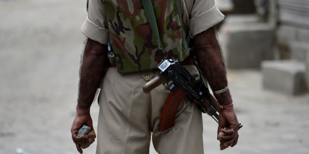 An Indian paramilitary officer holds stones in his hands during a clash with protesters in Srinagar on July 10, 2016.
The death toll from unrest in Indian-administered Kashmir climbed to 15 July 10, officials said, despite authorities imposing a harsher curfew on the restive territory in a bid to prevent new demonstrations. One protestor was killed on July 10 when government forces fired on angry residents who defied the restrictions in the southern Pulwama area, and six died in different hospitals overnight after suffering gunshot wounds on July 9, a police officer said, speaking on condition of anonymity.
/ AFP / TAUSEEF MUSTAFA (Photo credit should read TAUSEEF MUSTAFA/AFP/Getty Images)