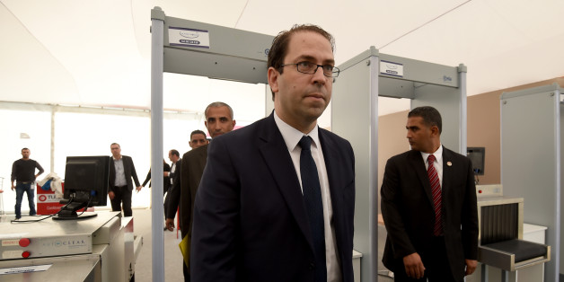 Tunisian Prime Minister Youssef Chahed (C) arrives to inspect the final preparation at the Congress Palace in the capital Tunis, on November 27, 2016, two days ahead of the opening ceremony of the 'Tunisia 2020' conference.
Tunisia will host 2,000 business and finance executives from 40 countries this week in hopes of drumming up investment to boost its struggling economy. / AFP / FETHI BELAID (Photo credit should read FETHI BELAID/AFP/Getty Images)