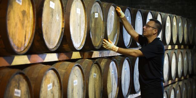 Danny Borzacciello stores a barrel at the Auchentoshan Distillery, a Single Malt whisky distillery, on the outskirts of Glasgow on December 12, 2016.
While most of Scotland voted against leaving the European Union, whisky makers have quietly been raising a wee dram to a side-effect of the Brexit vote -- a plunge in the value of the pound. The currency devaluation has made exports cheaper, generating a bump since 90 percent of Scotch whisky is sold outside Britain, although the industry warns the longer-term outlook is far more cloudy.
/ AFP / ANDY BUCHANAN / TO GO WITH AFP STORY BY MARK MCLAUGHLIN (Photo credit should read ANDY BUCHANAN/AFP/Getty Images)