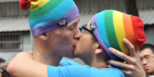 A same-sex couples kiss during an event outside the Legislative Council in Taipei on March 16, 2014. Dozens of members of the gay community gathered to demand same-sex marriages. AFP PHOTO / Mandy CHENG (Photo credit should read Mandy Cheng/AFP/Getty Images)