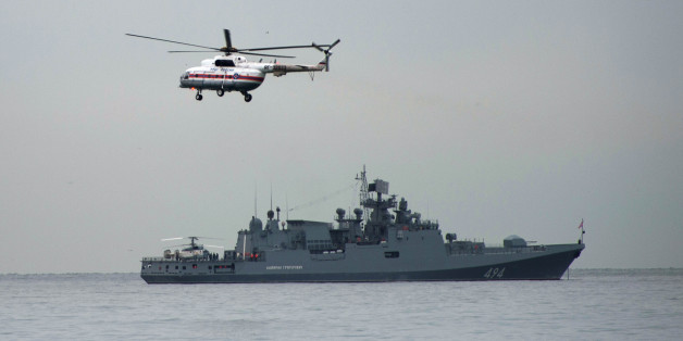 SOCHI, Dec. 27, 2016-- Photo taken on Dec. 27, 2016 shows a navy ship and a helicopter taking part in a rescue operation on the Black Sea coast at the crash site of Russian Defense Ministry's Tu-154 aircraft near Sochi, Russia. The main flight recorder of the Russian military Tu-154 aircraft that crashed Sunday into the Black Sea has been retrieved from the wreckage, the Russian Defense Ministry said Tuesday. (Xinhua/Sputnik via Getty Images)
