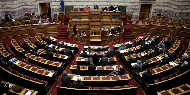 Greek lawmakers attend a parliamentary session before a vote on a one-off benefit approved to pensioners in Athens, Greece, December 15, 2016. REUTERS/Alkis Konstantinidis