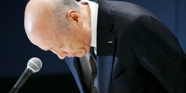 Tadashi Ishii, president of Japan's top advertising agency Dentsu Inc, bows during a news conference in Tokyo, Japan, in this photo taken by Kyodo December 28, 2016. Picture taken December 28, 2016. Mandatory credit Kyodo/via REUTERS ATTENTION EDITORS - THIS IMAGE WAS PROVIDED BY A THIRD PARTY. EDITORIAL USE ONLY. MANDATORY CREDIT. JAPAN OUT. NO COMMERCIAL OR EDITORIAL SALES IN JAPAN. TPX IMAGES OF THE DAY