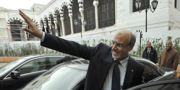 Outgoing Tunisian Prime Minister Hamadi Jebali waves to journalists at the end of the government handover ceremony in Tunis on March 14, 2013. Ali Larayedh became Tunisia's new Islamist premier, taking over from Jebali and faced with the task of ending a political and economic crisis gripping the country. AFP PHOTO/FETHI BELAID (Photo credit should read FETHI BELAID/AFP/Getty Images)