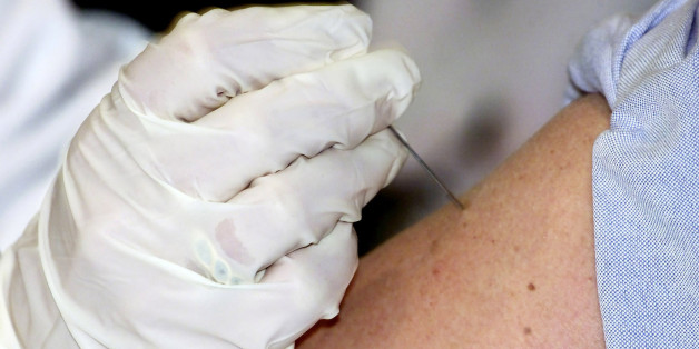 Dr. Marcia Trape of the University of Connecticut Health Center pushes
the smallpox vaccine immunization needle fifteen times into the arm of
Dr. Richard Garibaldi in front of the news media January 24, 2003 at
the Health Center in Farmington, Connecticut. Dr. Garibaldi was among
the the first volunteer participants in the U.S. Government's national
plan to vaccinate up to 500,000 health care workers and emergency
workers against the dangers of a smallpox outbreak that might result
from a terror attack. REUTERS/Jim Bourg
JRB/ME