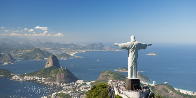 Aerial view of 'Christ The Redeemer' statue with Sugarloaf Mountain, Copacabana Beach and Botafogo Beach in the background.